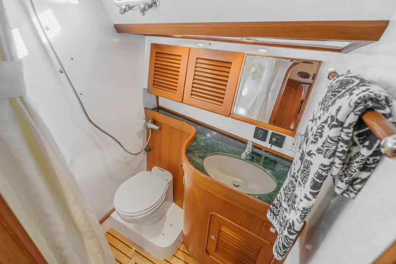 Slide: The Image of Luxurious bathroom in 2012 Hylas 46 yacht with wooden cabinetry and modern fixtures. - 49