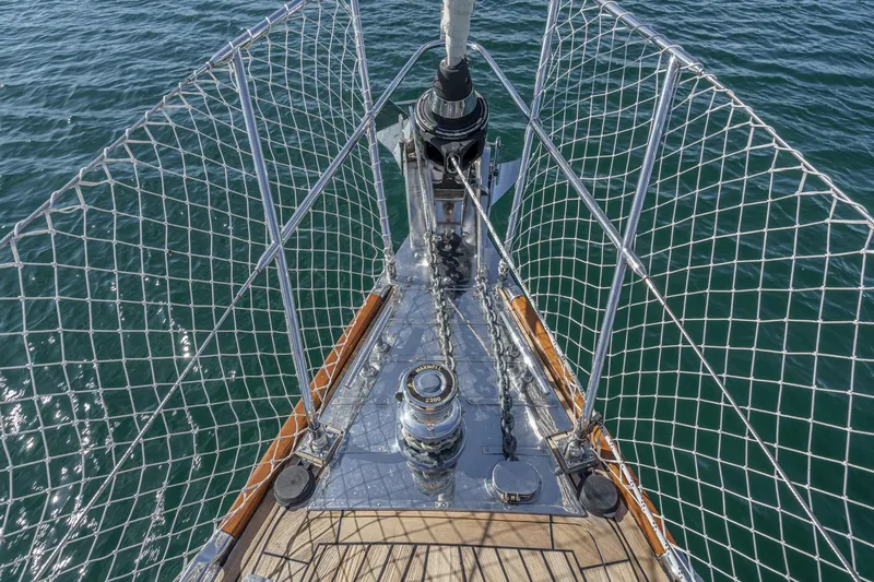 Slide: The Image of Bow of 2012 Hylas 46 yacht with stainless steel fittings and safety netting. - 8