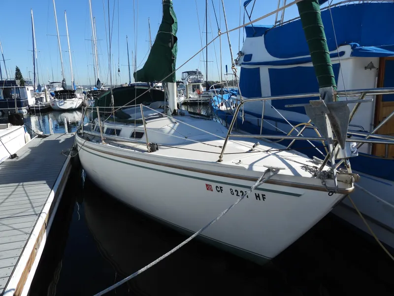 The Image of 1983 Catalina 30 sailboat docked in marina. - 0