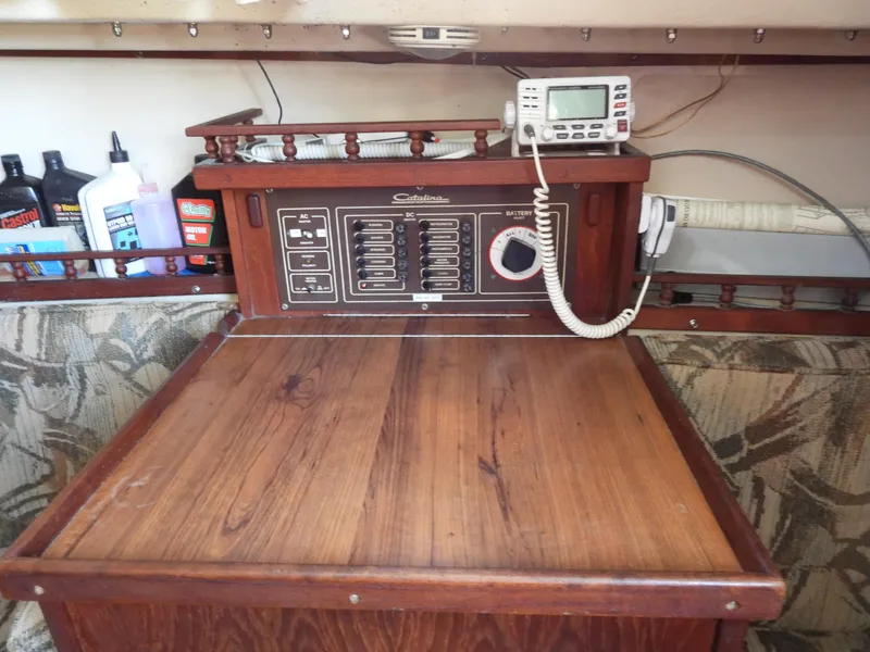 Slide: The Image of 1983 Catalina 30 boat interior with control panel. - 10
