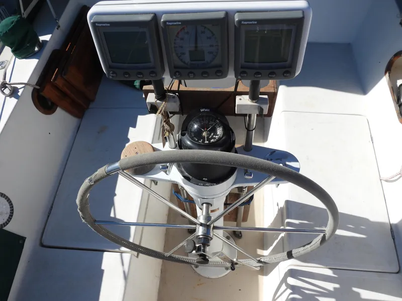 Slide: The Image of Steering wheel and instruments of a 1983 Catalina 30 sailboat. - 3