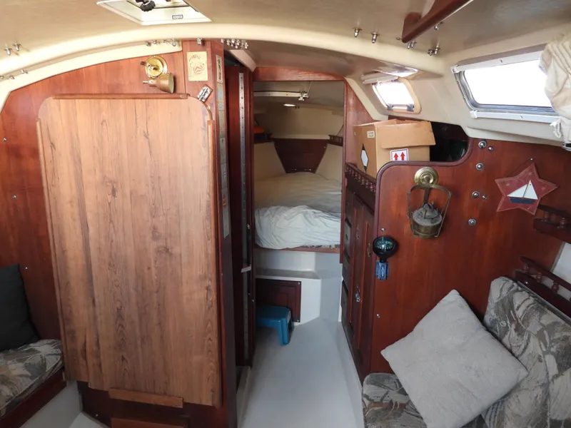 Slide: The Image of Interior of a 1983 Catalina 30 yacht with wooden furnishings. - 6