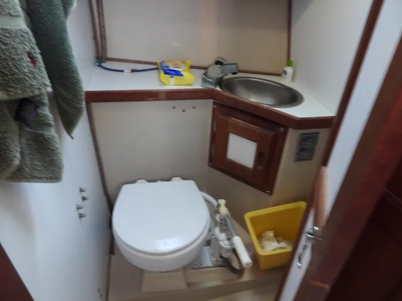 Slide: The Image of Compact bathroom in a 1983 Catalina 30 yacht. - 7