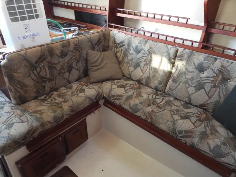 Slide: The Image of Interior of a 1983 Catalina 30 with patterned cushions. - 8