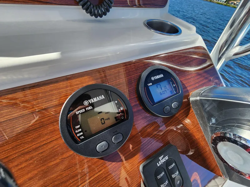 Slide: The Image of Dashboard of 2022 Spanish Wells 21 boat with Yamaha gauges on a sunny day. - 17