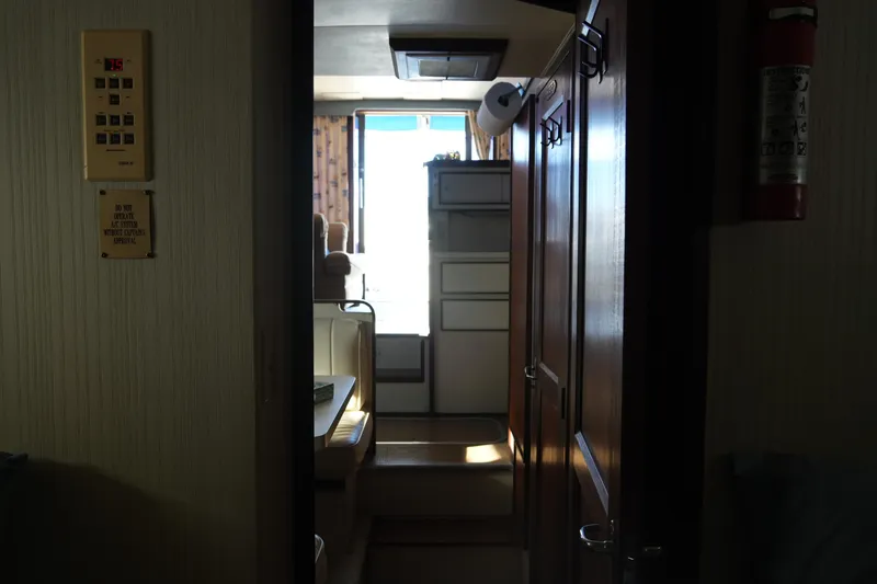 Slide: The Image of Interior view of 1987 Hatteras 36 Convertible yacht, featuring hallway and cabin area. - 22