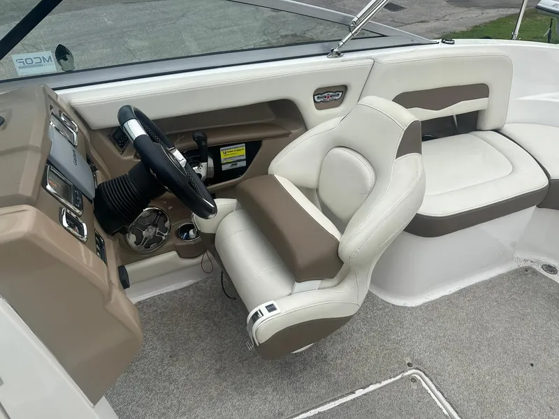Slide: The Image of Interior of 2013 Chaparral 246 SSi boat with beige and white seating. - 4