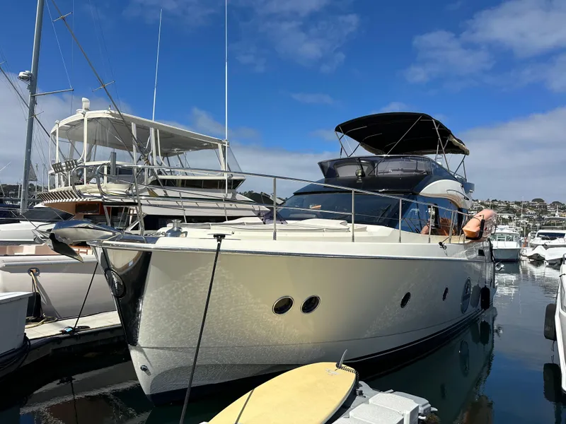 Slide: The Image of 2017 Beneteau Monte Carlo 5 MC5 yacht docked at marina under clear blue sky. - 1