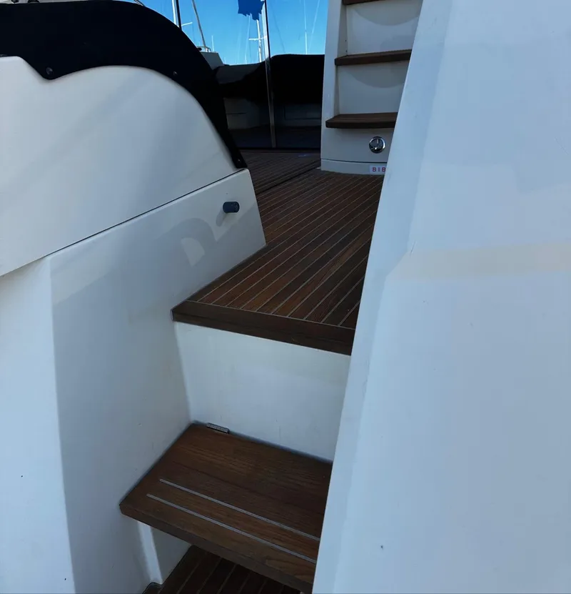 Slide: The Image of 2017 Beneteau Monte Carlo 5 MC5 yacht stairs with teak decking. - 10