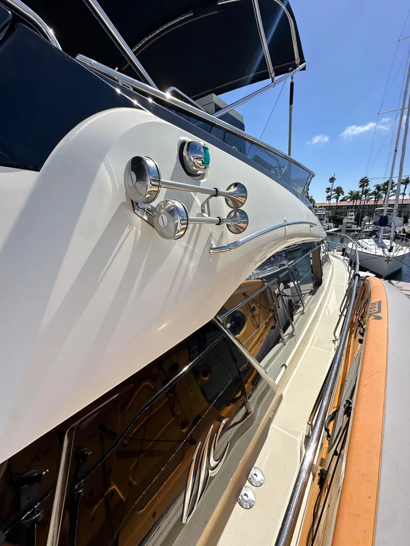 Slide: The Image of 2017 Beneteau Monte Carlo 5 MC5 yacht docked under clear blue sky. - 16