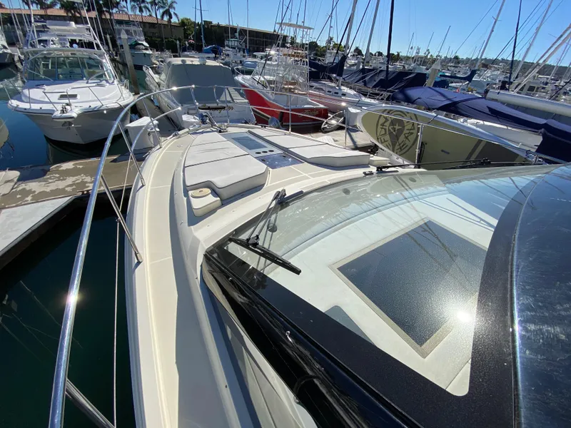 Slide: The Image of 2017 Beneteau Monte Carlo 5 MC5 yacht docked in marina, showcasing sleek design and spacious deck. - 18