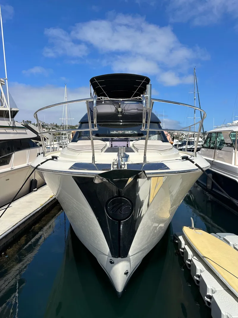 Slide: The Image of 2017 Beneteau Monte Carlo 5 MC5 yacht docked in marina under blue sky. - 2