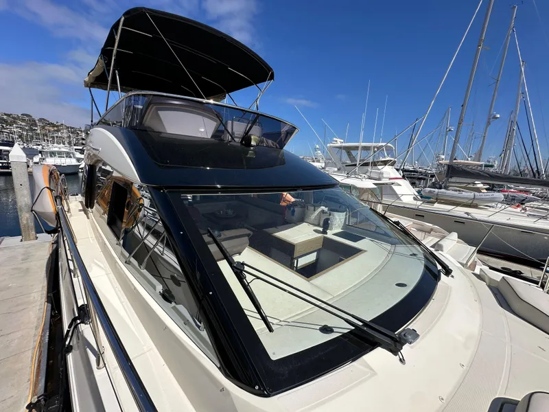 Slide: The Image of 2017 Beneteau Monte Carlo 5 MC5 yacht docked at marina under clear blue sky. - 29