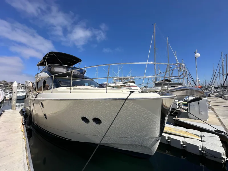 Slide: The Image of 2017 Beneteau Monte Carlo 5 MC5 yacht docked at marina under clear blue sky. - 3