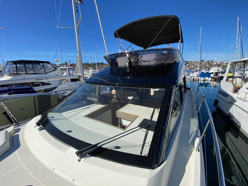 Slide: The Image of 2017 Beneteau Monte Carlo 5 MC5 yacht docked in marina under clear blue sky. - 30