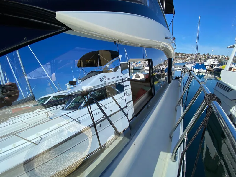 Slide: The Image of 2017 Beneteau Monte Carlo 5 MC5 yacht docked in marina, reflecting clear blue sky. - 31