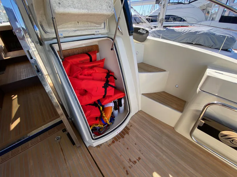 Slide: The Image of 2017 Beneteau Monte Carlo 5 MC5 yacht with life jackets stored in a compartment. - 36