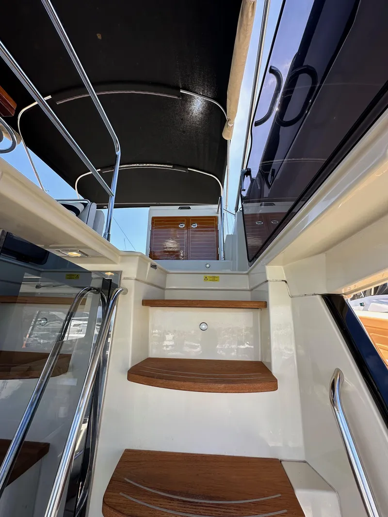 Slide: The Image of Staircase on 2017 Beneteau Monte Carlo 5 MC5 yacht, featuring sleek wooden steps and modern design. - 38