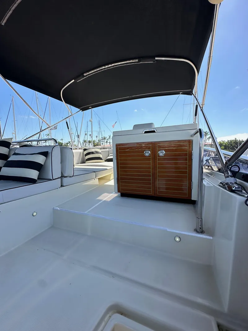 Slide: The Image of 2017 Beneteau Monte Carlo 5 MC5 yacht interior with seating and storage under canopy. - 39
