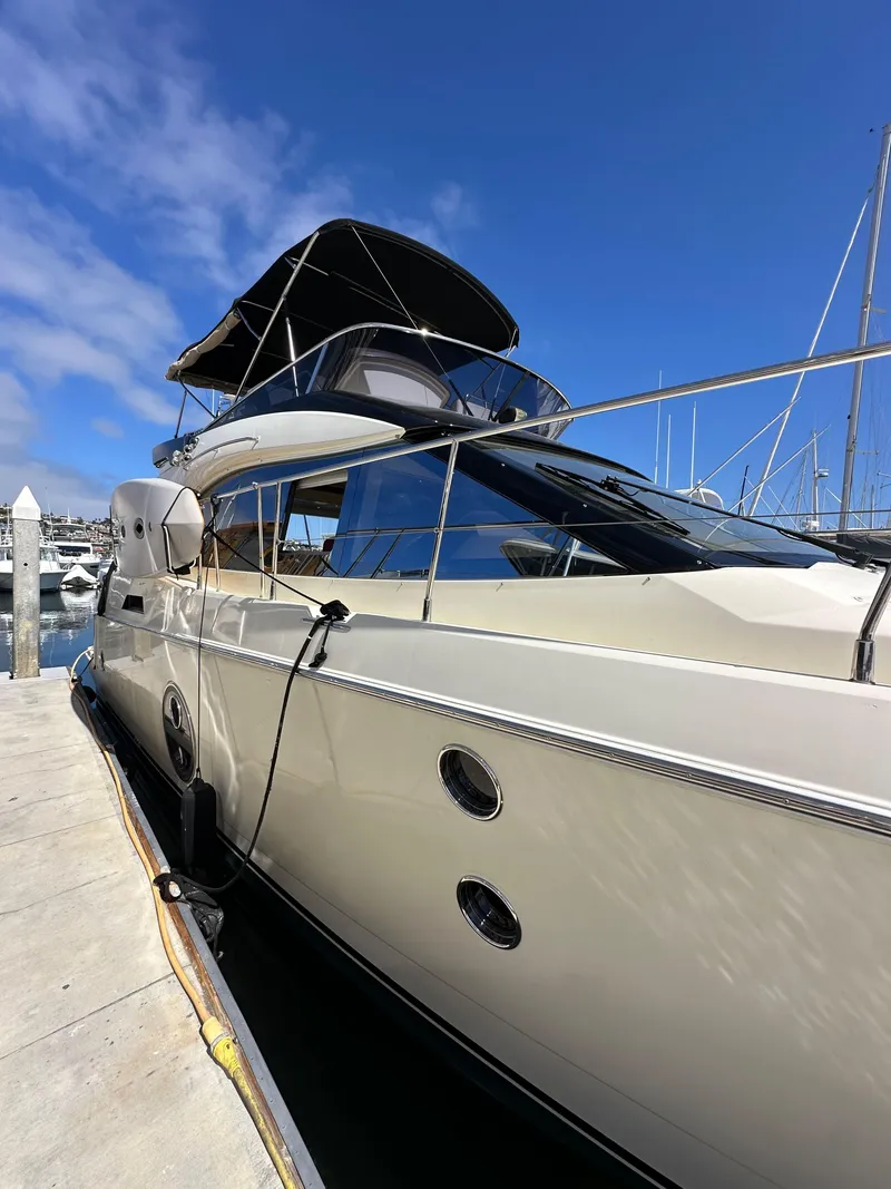 Slide: The Image of 2017 Beneteau Monte Carlo 5 MC5 yacht docked under clear blue sky. - 4
