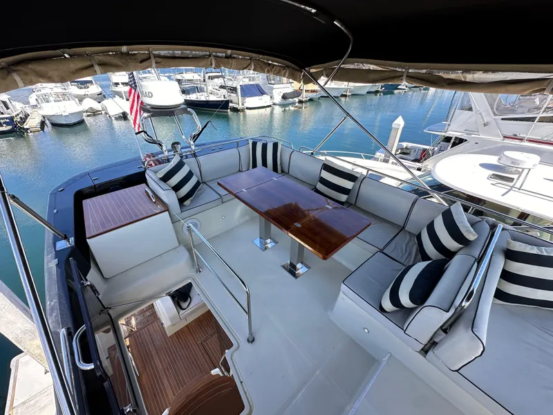 Slide: The Image of Luxurious 2017 Beneteau Monte Carlo 5 MC5 yacht with elegant seating and marina view. - 40