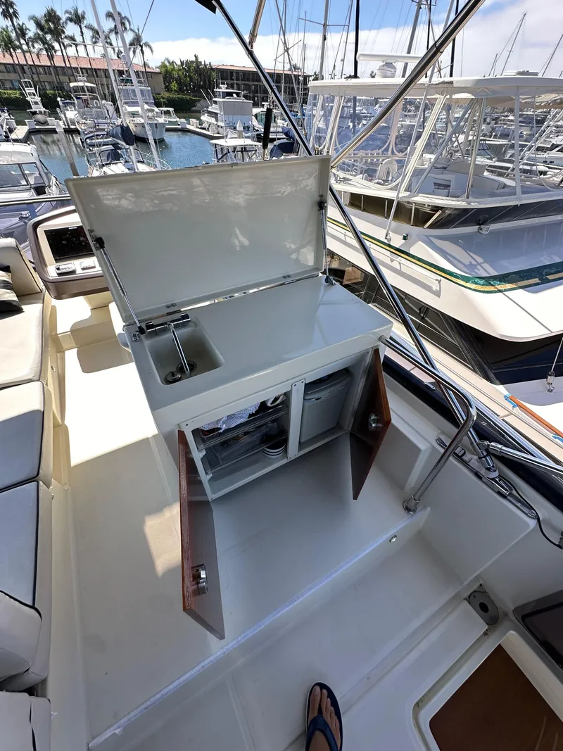 Slide: The Image of 2017 Beneteau Monte Carlo 5 MC5 yacht with open storage on deck, marina view. - 47