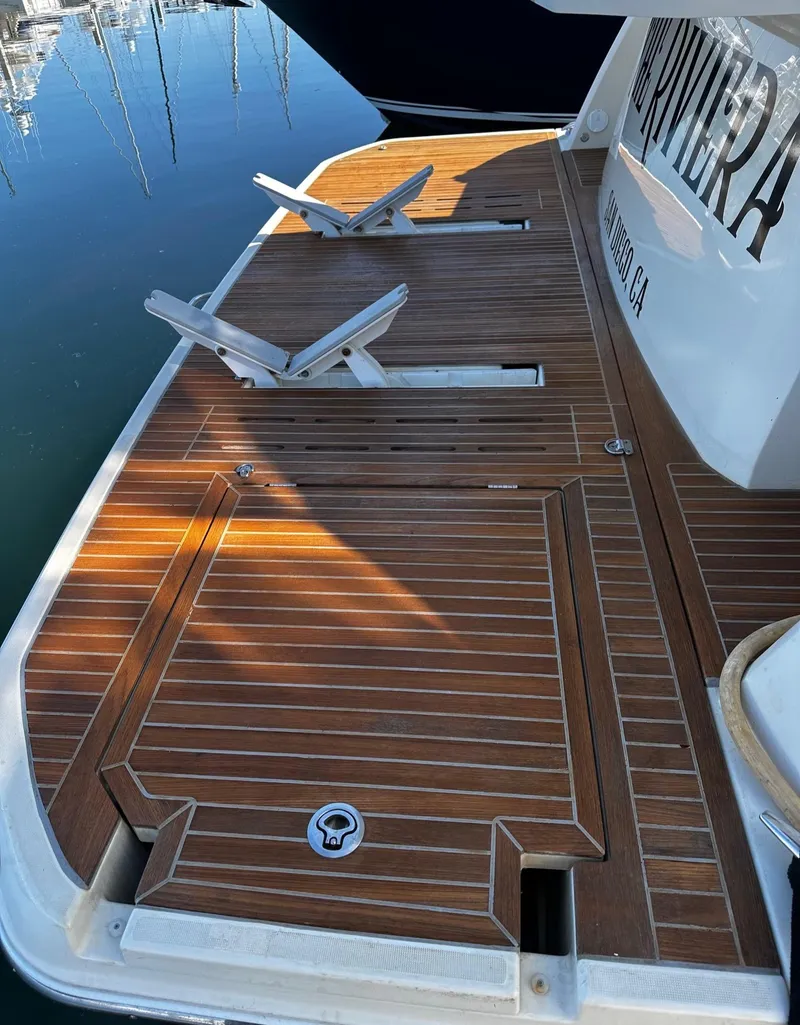 Slide: The Image of 2017 Beneteau Monte Carlo 5 MC5 yacht with teak swim platform and folding chairs. - 7