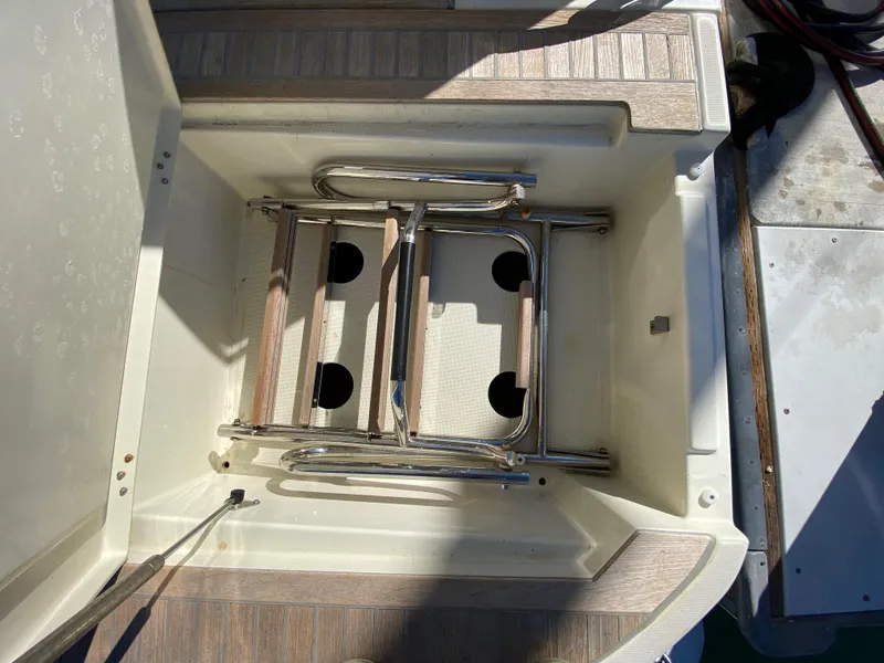Slide: The Image of Beneteau Monte Carlo 5 MC5 2017 swim platform ladder storage compartment. - 8