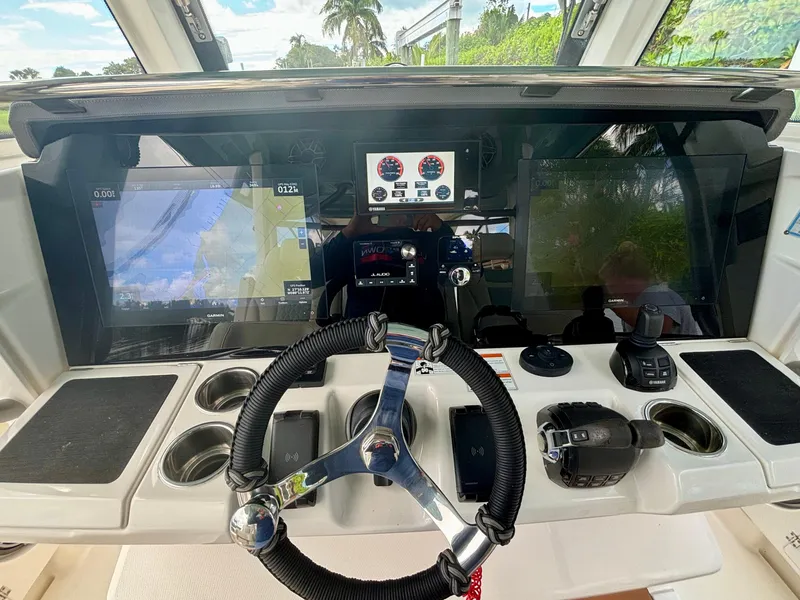 Slide: The Image of 2020 Solace 345 CC boat dashboard with advanced navigation and control systems. - 10