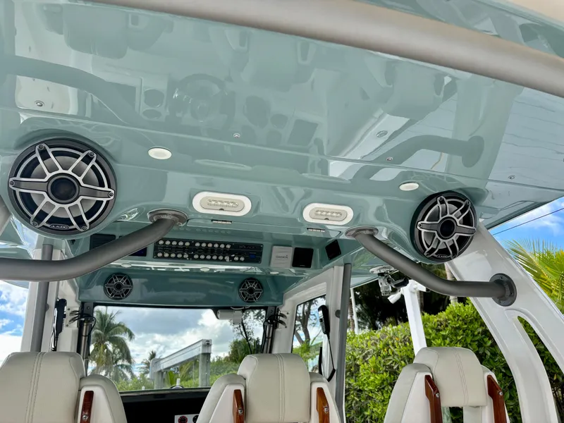 Slide: The Image of Interior view of 2020 Solace 345 CC boat with speakers and seating. - 14