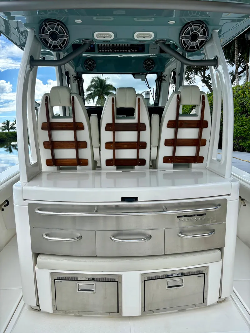 Slide: The Image of 2020 Solace 345 CC boat interior with sleek seating and storage compartments. - 18