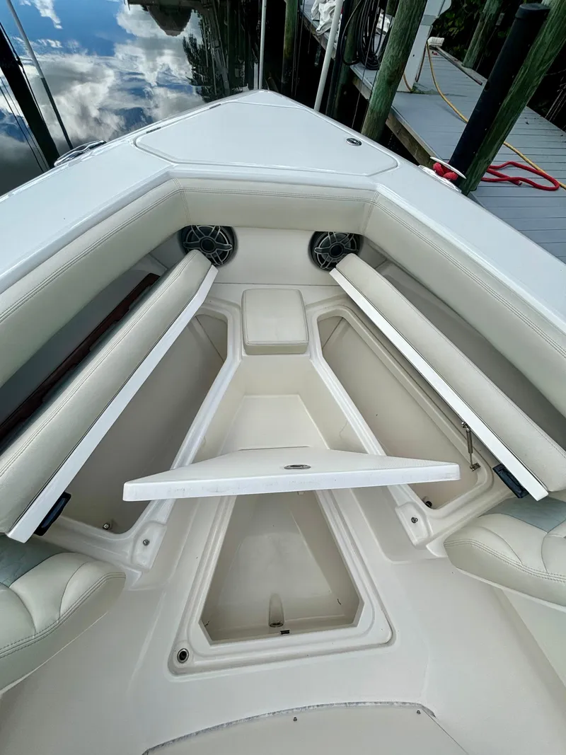 Slide: The Image of 2020 Solace 345 CC boat interior with open storage compartments and seating. - 8