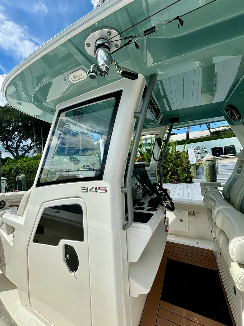 Slide: The Image of 2020 Solace 345 CC boat interior with modern helm and seating. - 9