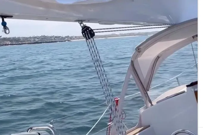 Slide: The Image of Sailing on a 2026 Tartan 335 yacht, overlooking calm ocean waters. - 8