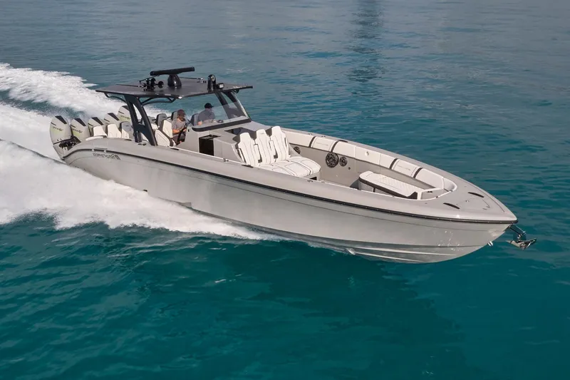 Slide: The Image of 2021 Midnight Express 43 Open boat cruising on clear blue water. - 1