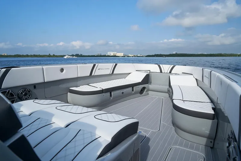 Slide: The Image of 2021 Midnight Express 43 Open boat with luxurious seating on calm waters. - 10