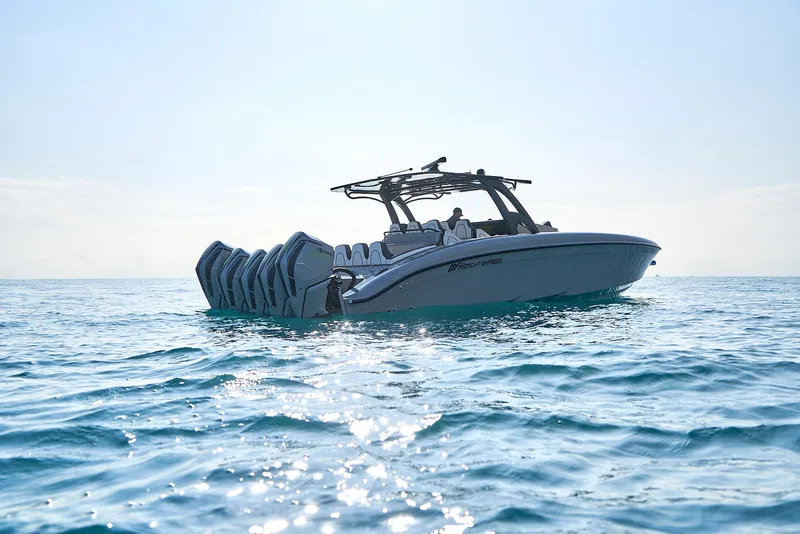 Slide: The Image of 2021 Midnight Express 43 Open boat cruising on clear blue water. - 14