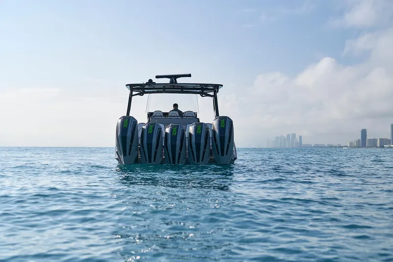 Slide: The Image of 2021 Midnight Express 43 Open boat on open water with city skyline in background. - 3