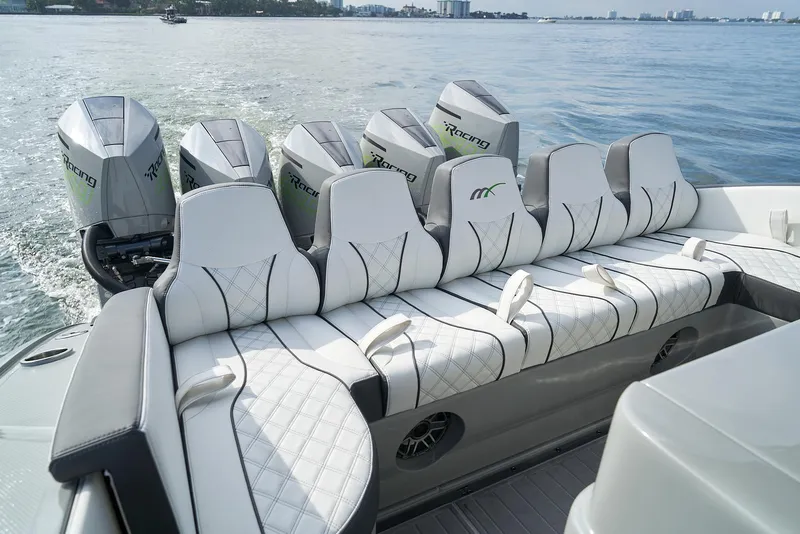 Slide: The Image of 2021 Midnight Express 43 Open boat with luxurious seating and powerful engines on the water. - 4