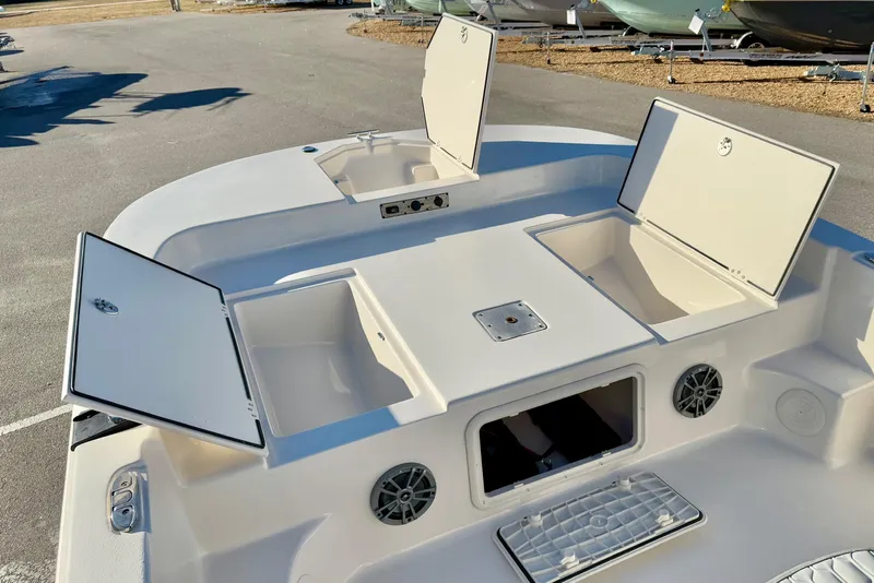 Slide: The Image of 2025 Carolina Skiff 21 LS boat with open storage compartments and speakers. - 10