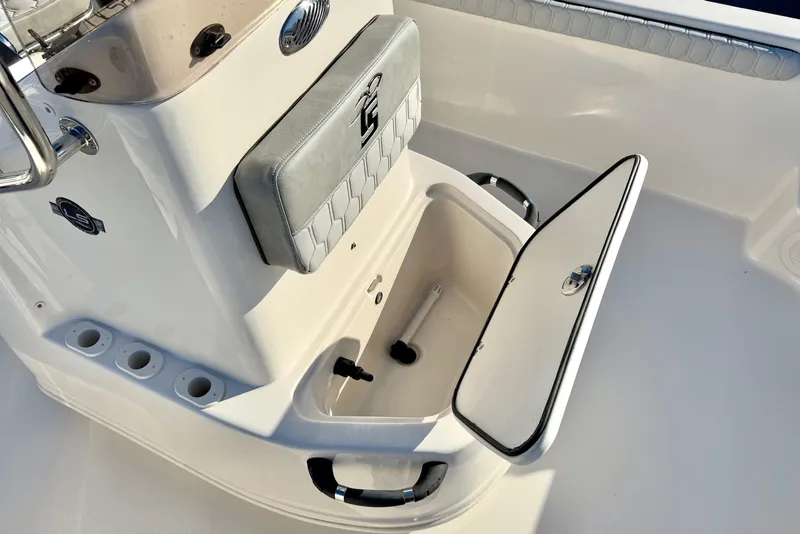 Slide: The Image of 2025 Carolina Skiff 21 LS boat seat with hexagonal pattern and logo detail. - 13