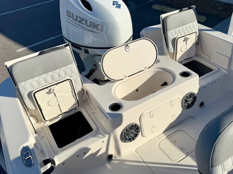 Slide: The Image of 2025 Carolina Skiff 21 LS boat seat and rod holders at dealership. - 19