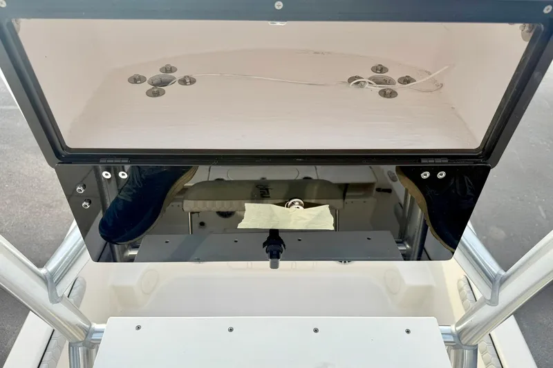 Slide: The Image of 2025 Carolina Skiff 21 LS boat console with storage compartment and mounting hardware. - 21
