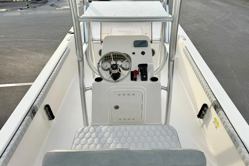 Slide: The Image of 2025 Carolina Skiff 21 LS boat interior with steering console and seating. - 25