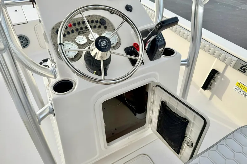 Slide: The Image of 2025 Carolina Skiff 21 LS boat console with steering wheel and control panel. - 27
