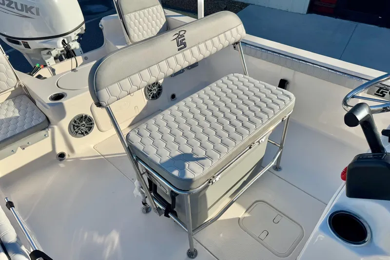 Slide: The Image of 2025 Carolina Skiff 21 LS boat interior with cushioned seating and storage. - 28