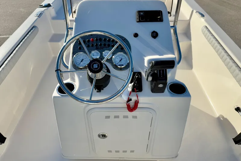 Slide: The Image of 2025 Carolina Skiff 21 LS boat console with steering wheel and controls. - 3