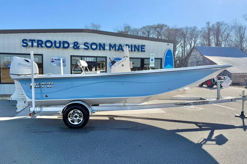 Slide: The Image of 2025 Carolina Skiff 21 LS boat on trailer at Stroud and Son Marine dealership. - 4