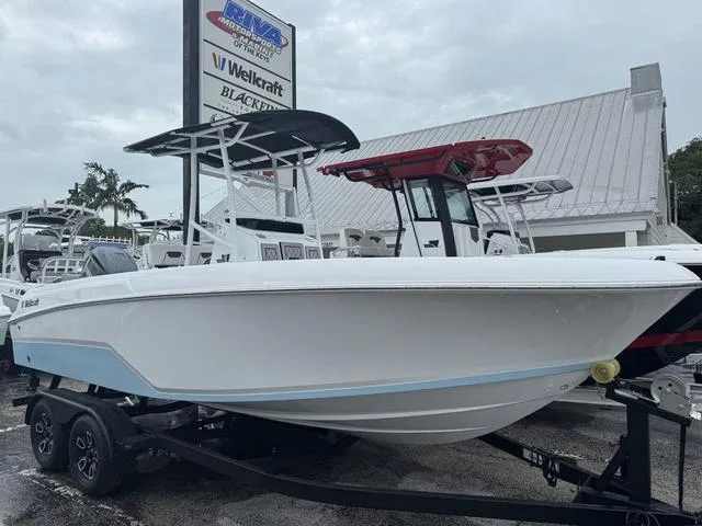 Slide: The Image of 2025 Wellcraft 202 Fisherman boat on trailer at dealership. - 1