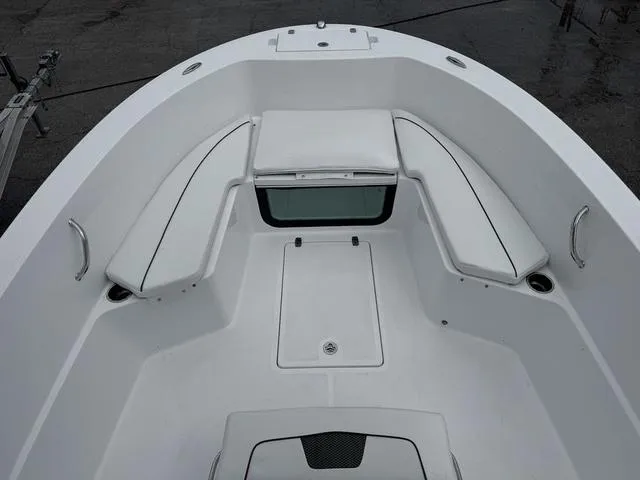 Slide: The Image of 2025 Wellcraft 202 Fisherman boat interior with seating and storage compartments. - 13